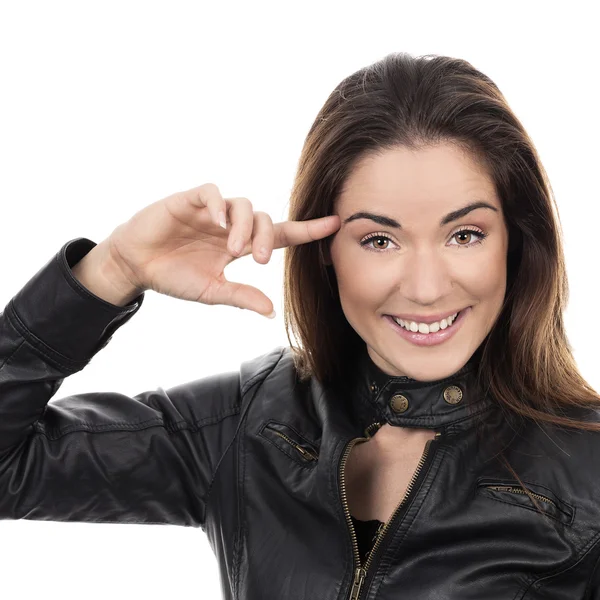 Mooi meisje vinger in de buurt van hoofd houden — Stockfoto