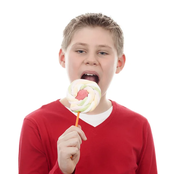 Chico comer grande lollipop — Foto de Stock