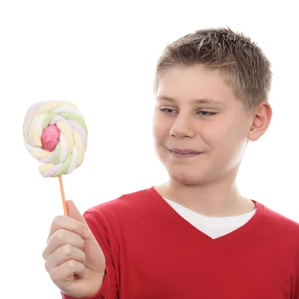 Boy looking at lollipop — Stock Photo, Image