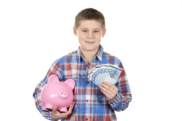 Lindo chico con alcancía y billete —  Fotos de Stock