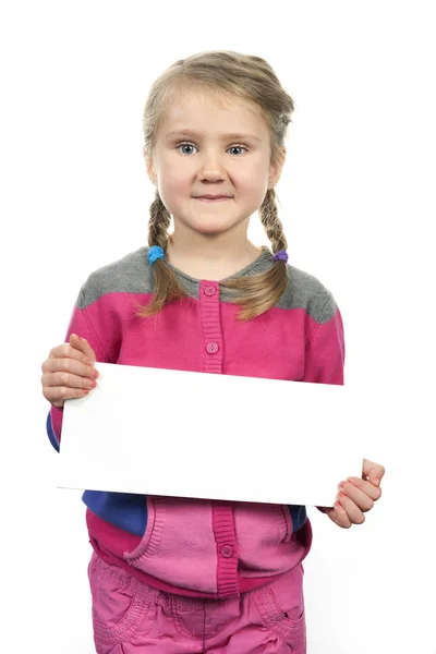 Cute girl standing with empty horizontal blank — Stock Photo, Image
