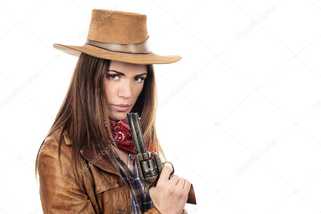 Beautiful cowgirl with gun
