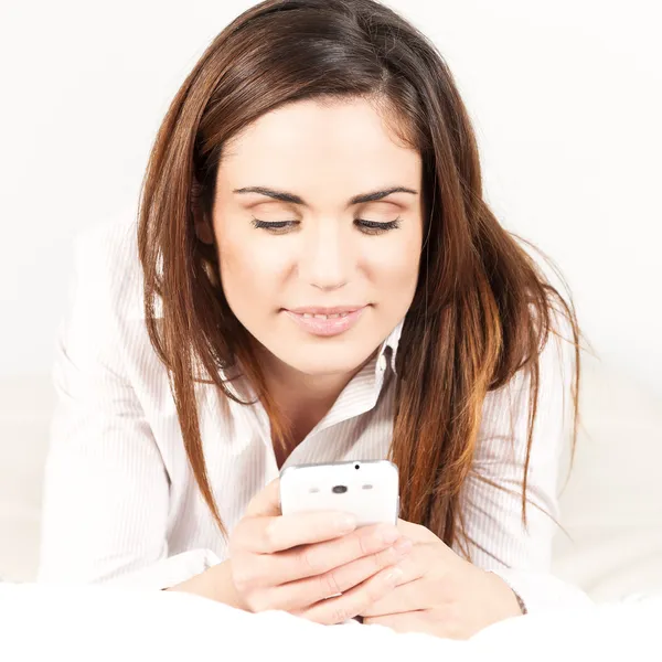 Woman with Smartphone on the Sofa — Stock Photo, Image