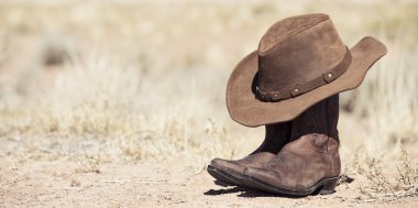 brown cowboy hat and boots outdoor clipart