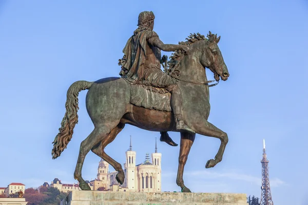 Statue of Louis XIV and Fourviere basilica — Stock Photo, Image