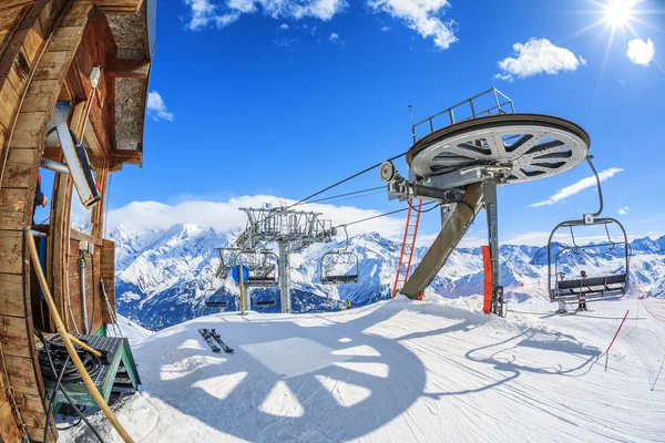 Ski lift chairs and sun — Stock Photo, Image