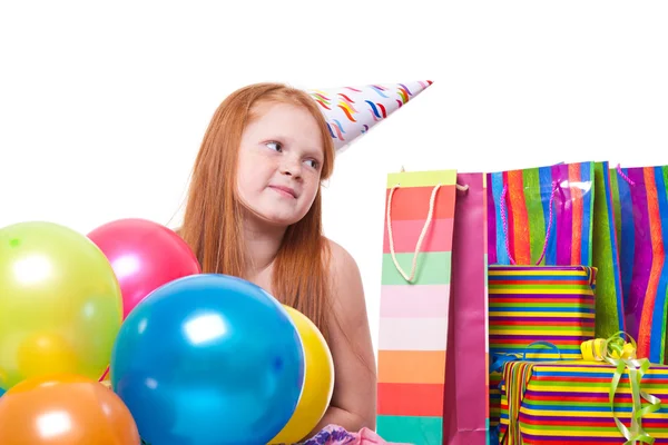 Happy party redhead girl with balloons and gift box — Stock Photo, Image