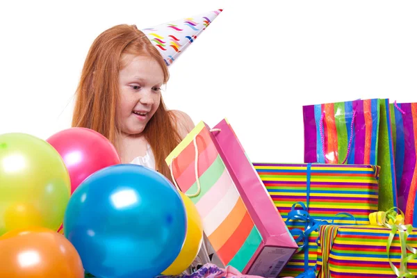 Happy party redhead girl with balloons and gift box — Stock Photo, Image
