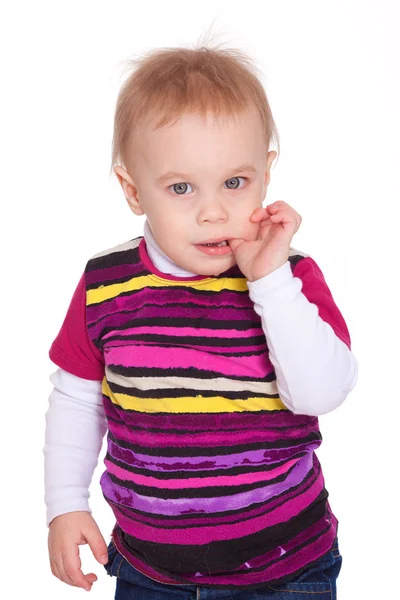 Funny little boy with finger in mouth — Stock Photo, Image