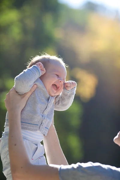 Happy baby in mother hands — Stock Photo, Image