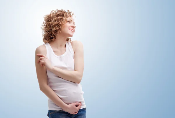 Pregnant woman on blue background — Stock Photo, Image