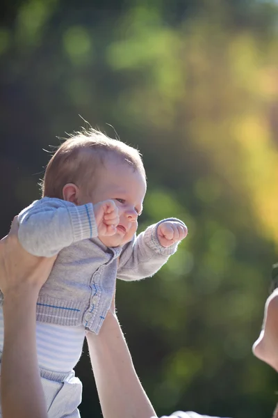 Happy baby in mother hands — Stock Photo, Image