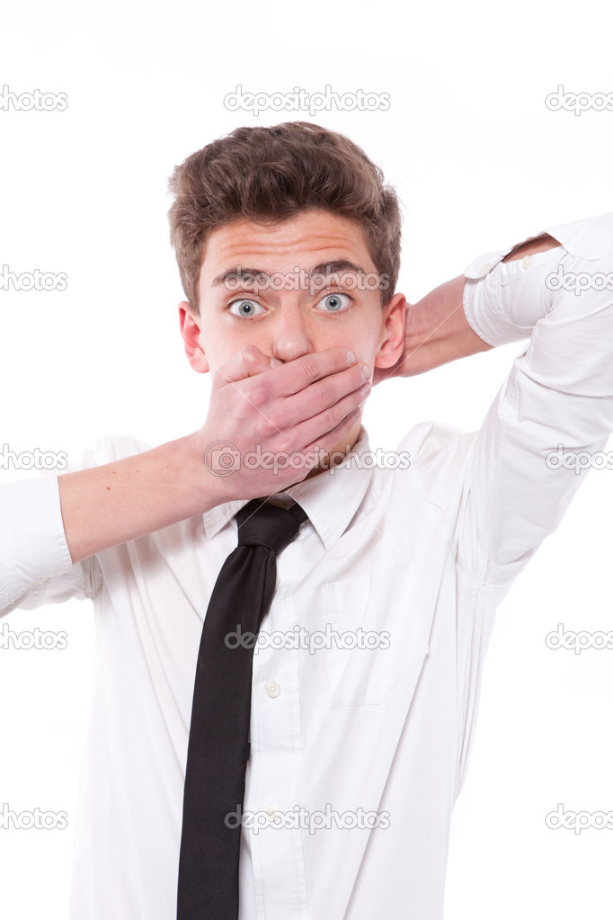 portrait of amazed boy covering his mouth over white background