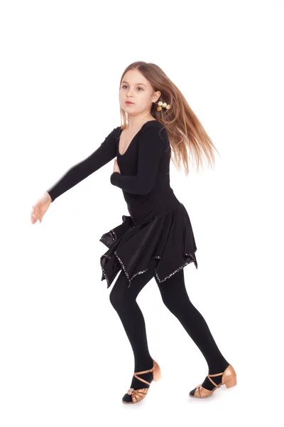 Glückliches kleines Mädchen tanzt isoliert auf weißem Hintergrund — Stockfoto