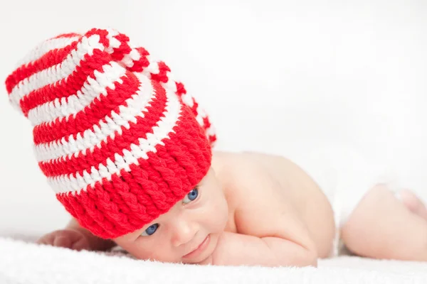 Baby in funny red hat — Stock Photo, Image