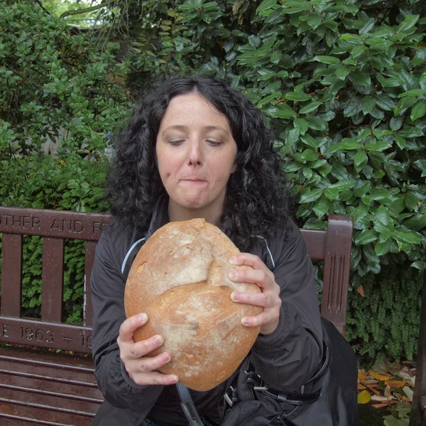 Girl eating bread — Stock Photo, Image