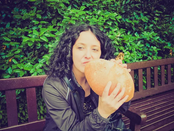 Girl eating bread — Stock Photo, Image