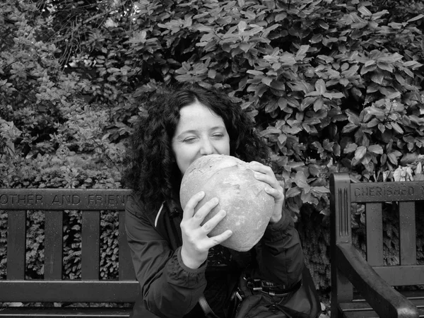 Girl eating bread — Stock Photo, Image