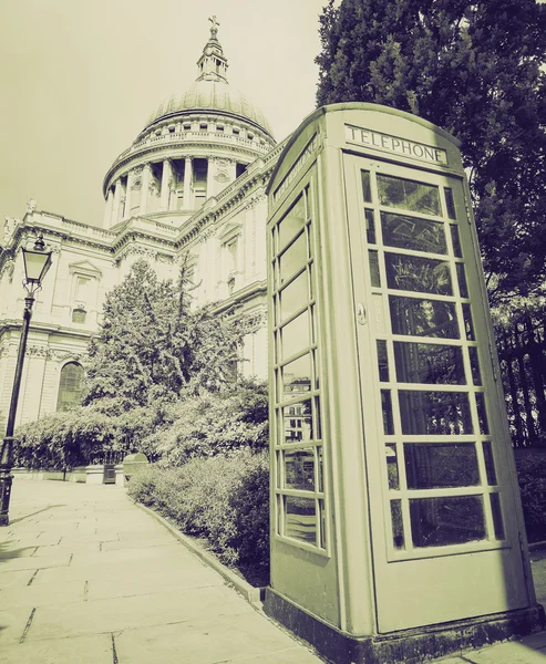 Vintage sepia London telephone box — Stock Photo, Image