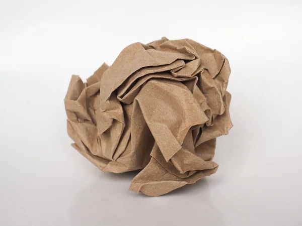 棕色纸背上的折皱纸球 — 图库照片