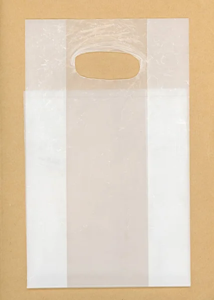 Transparent Plastic Bag Light Brown Background — Stock Photo, Image