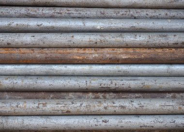 Paslanmış gri metal borular arka plan olarak kullanışlı