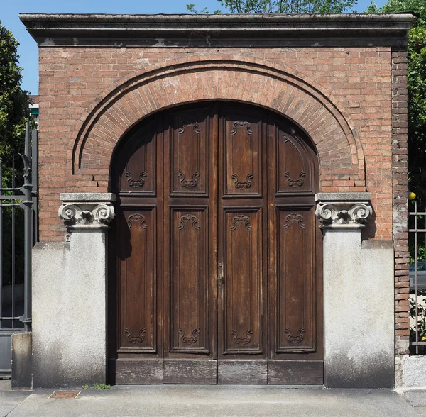 Ancient Wooden Gate Red Brick Arch Columns Ionic Capitals — стоковое фото