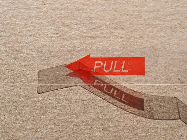 Pull Label Red Arrow Indicating Direction — Stock Photo, Image