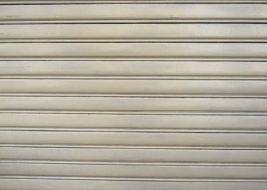 yellow aluminium rolling shutter metal texture useful as a background