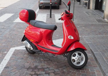 BIELLA, ITALY - CIRCA JULY 2022: red Italian Vespa scooter motorcycle