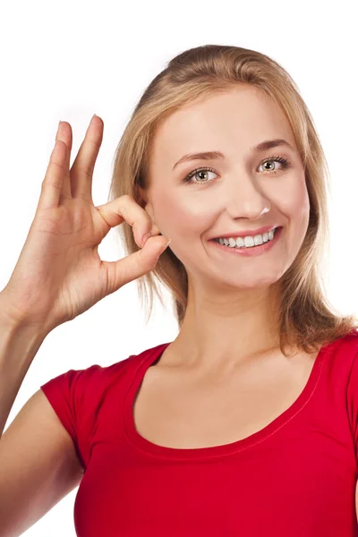 Attractive female student in red shows okay — Stock Photo, Image