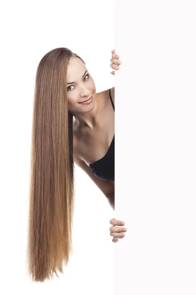 Girl with long hair holding a poster — Stock Photo, Image