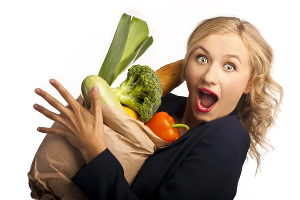 Girl gazdaság egy táska-ból étel — Stock Fotó