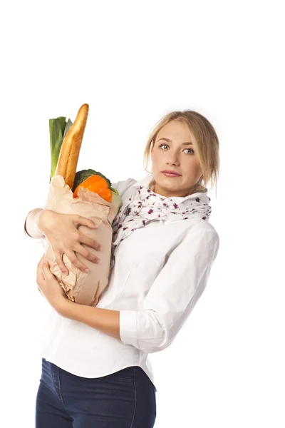 Attractive woman holding a bag of useful food — Stock Photo, Image