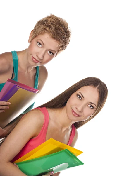 Two young studenys woman on the white background — Stock Photo, Image