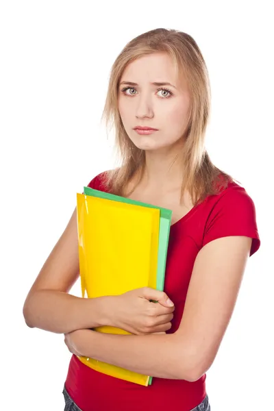 Estudiante abatida mirando la pila de archivos junto a ella —  Fotos de Stock