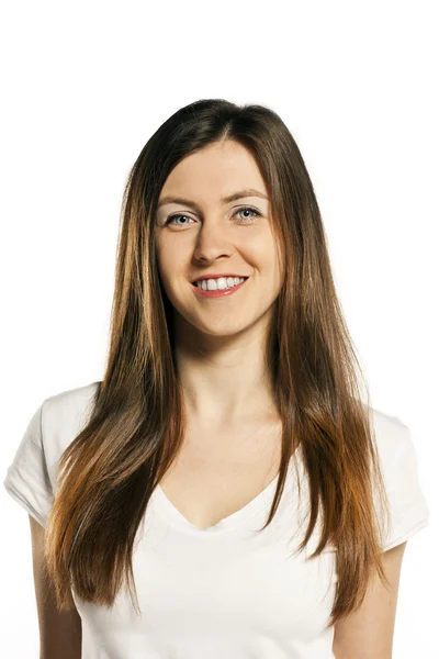 Beautiful young woman in white t-shirt posing in studio — Stock Photo, Image