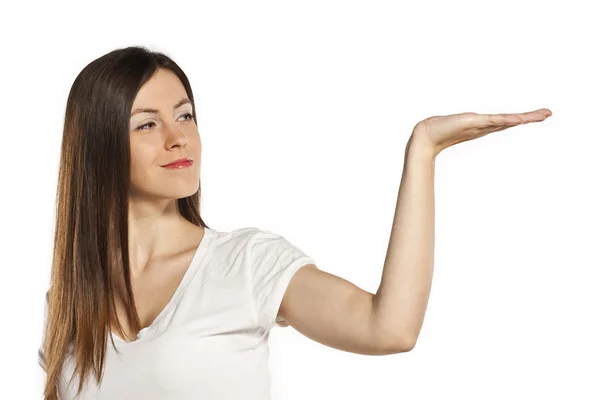 Attraente giovane studente in possesso di una mano aperta in studio — Foto Stock