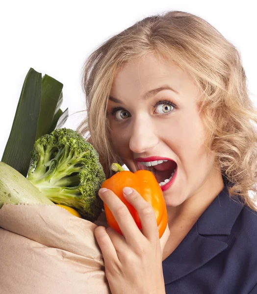 Attractive woman holding a bag of useful food — Stock Photo, Image