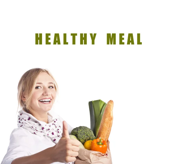 Smiling young woman holding a shopping bag — Stock Photo, Image