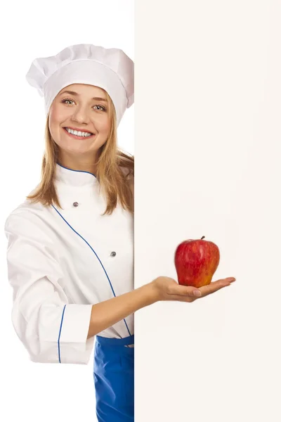 Nuttig vegetarisch voedsel. jonge kok in de studio — Stockfoto