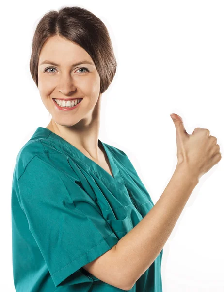 Young woman doctor giving thumbs up sign — Stock Photo, Image