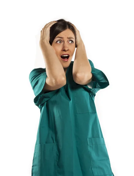 Young nurse in shock. studio white background — Stock Photo, Image