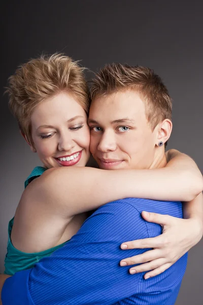 Young beautiful couple in the studio — Stock Photo, Image