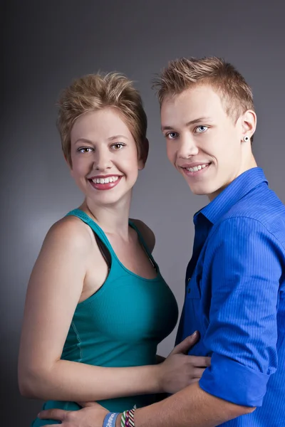 Young beautiful couple in the studio — Stock Photo, Image