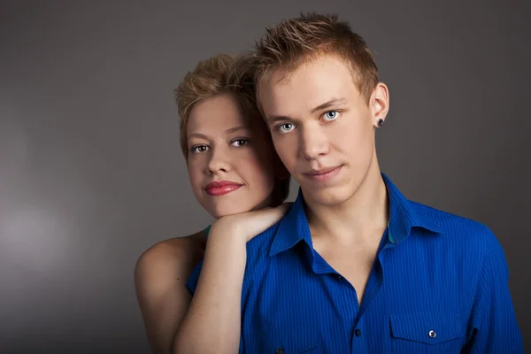 Young beautiful couple in the studio — Stock Photo, Image