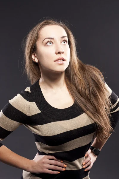 Female against a dark background. striped jacket — Stock Photo, Image