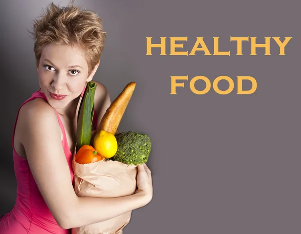 Beautiful woman with vegetables — Stock Photo, Image