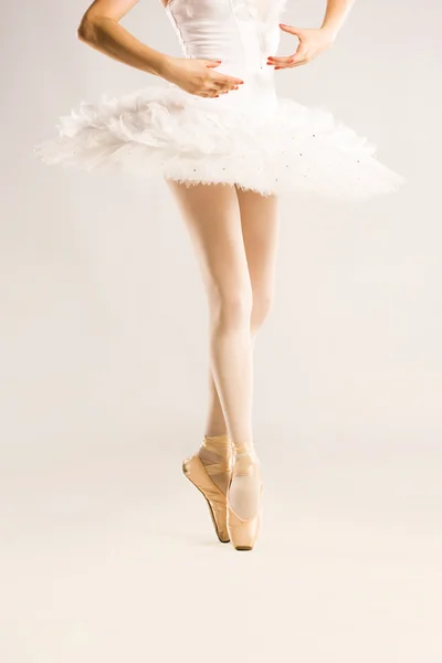 Beauty legs of ballerina on white — Stock Photo, Image