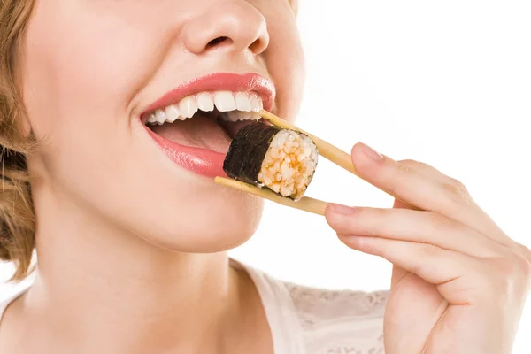 Student eats sushi — Stock Photo, Image